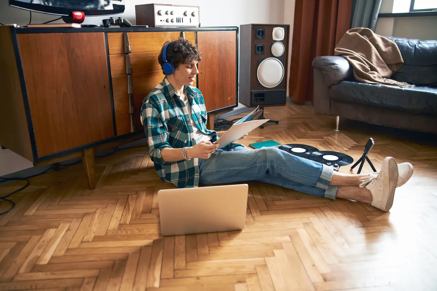 Woman watching content at home with headphones